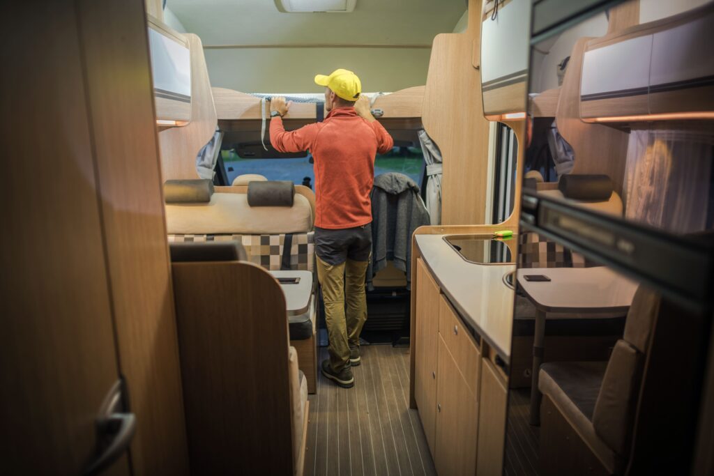 men-preparing-rv-summer-season-looking-bunk-bed-modern-class-c-motorhome-interior-recreational-vehicle (2)