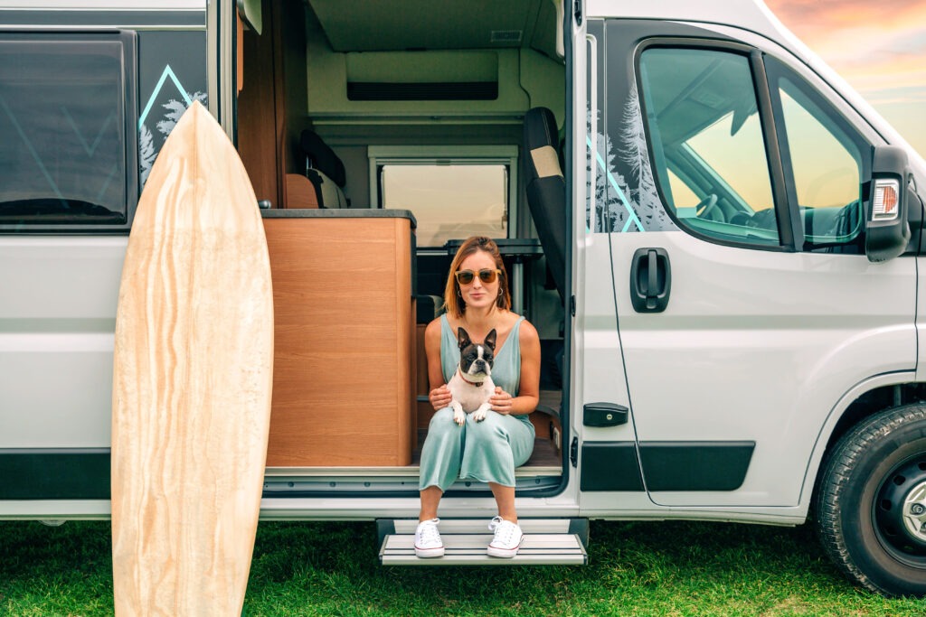 woman-sitting-with-her-dog-door-her-camper-van-trip (2)